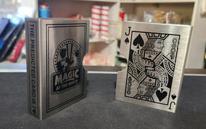 A silver metal card guard with a prediction card design